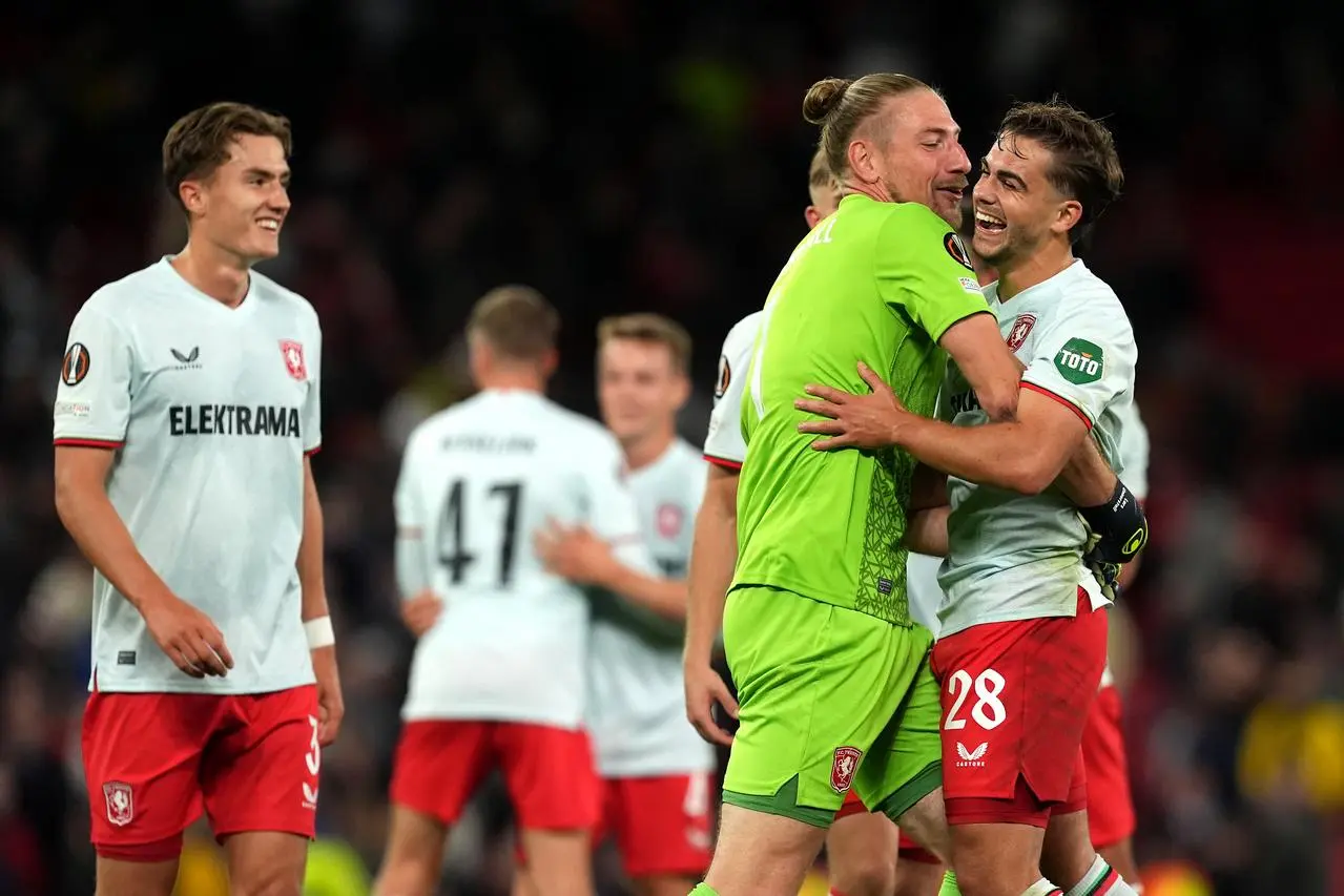 FC Twente celebrate their draw against Manchester United at Old Trafford