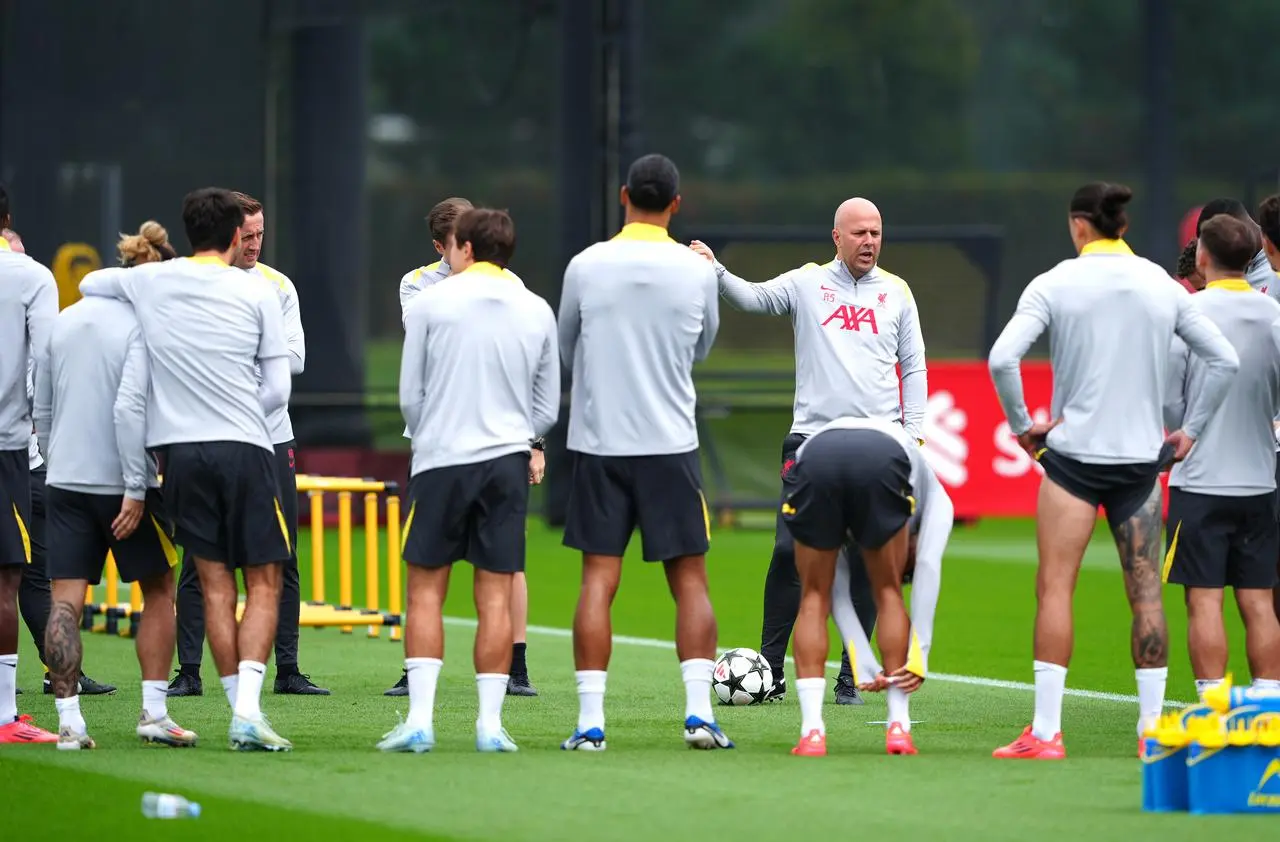 Arne Slot, third right, speaks to his Liverpool players during a training session