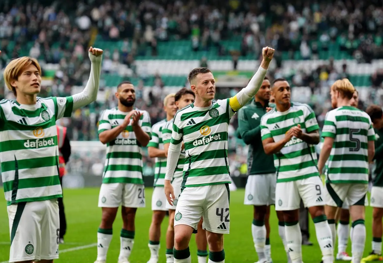 Goalscorers Callum McGregor, centre, and Kyogo Furuhashi, left, lead the Celtic celebrations at full-time against Rangers