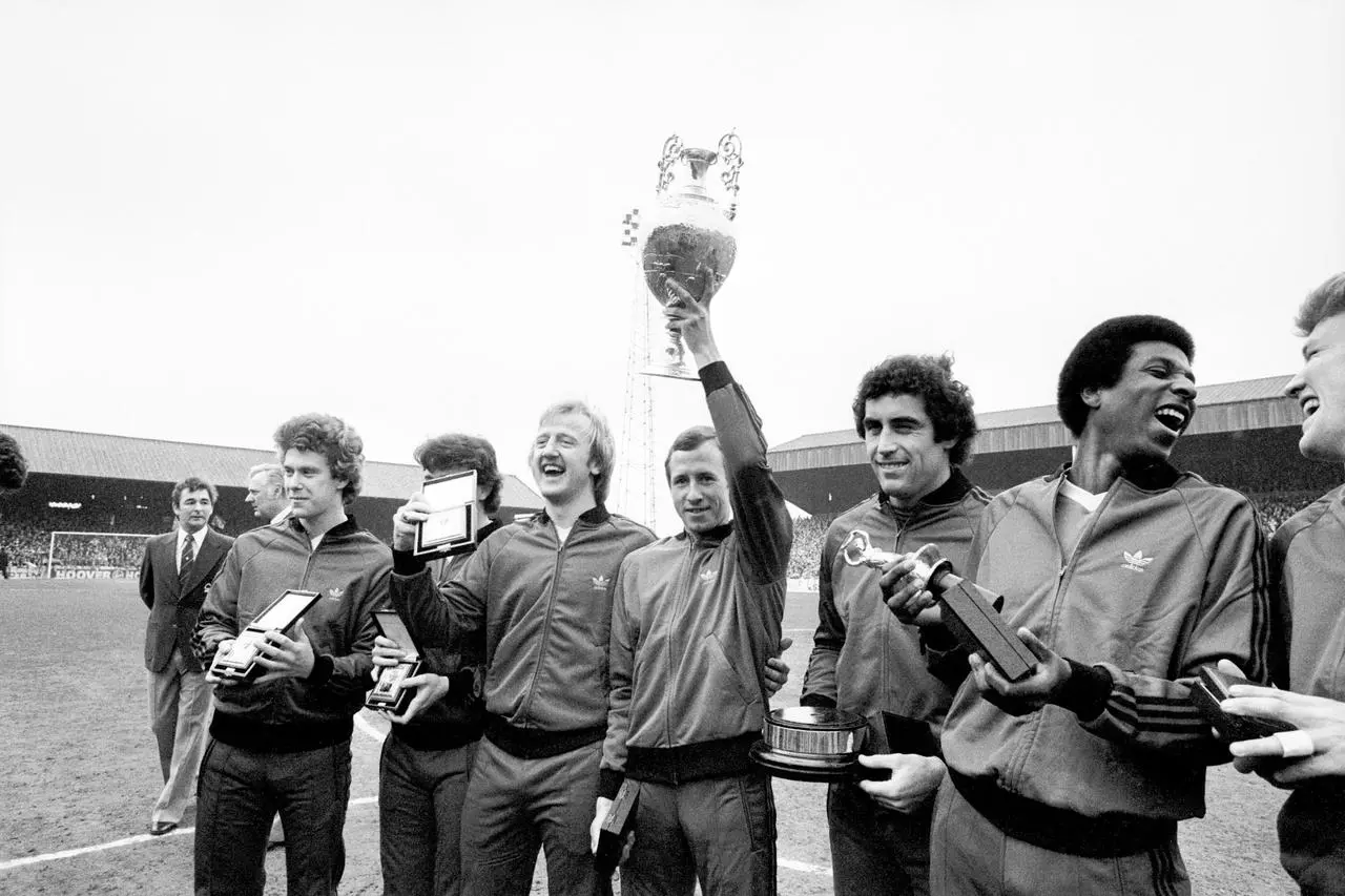 Nottingham Forest captain John McGovern (fourth left) holds up the 1978  League Championship trophy aloft as his teammates celebrate