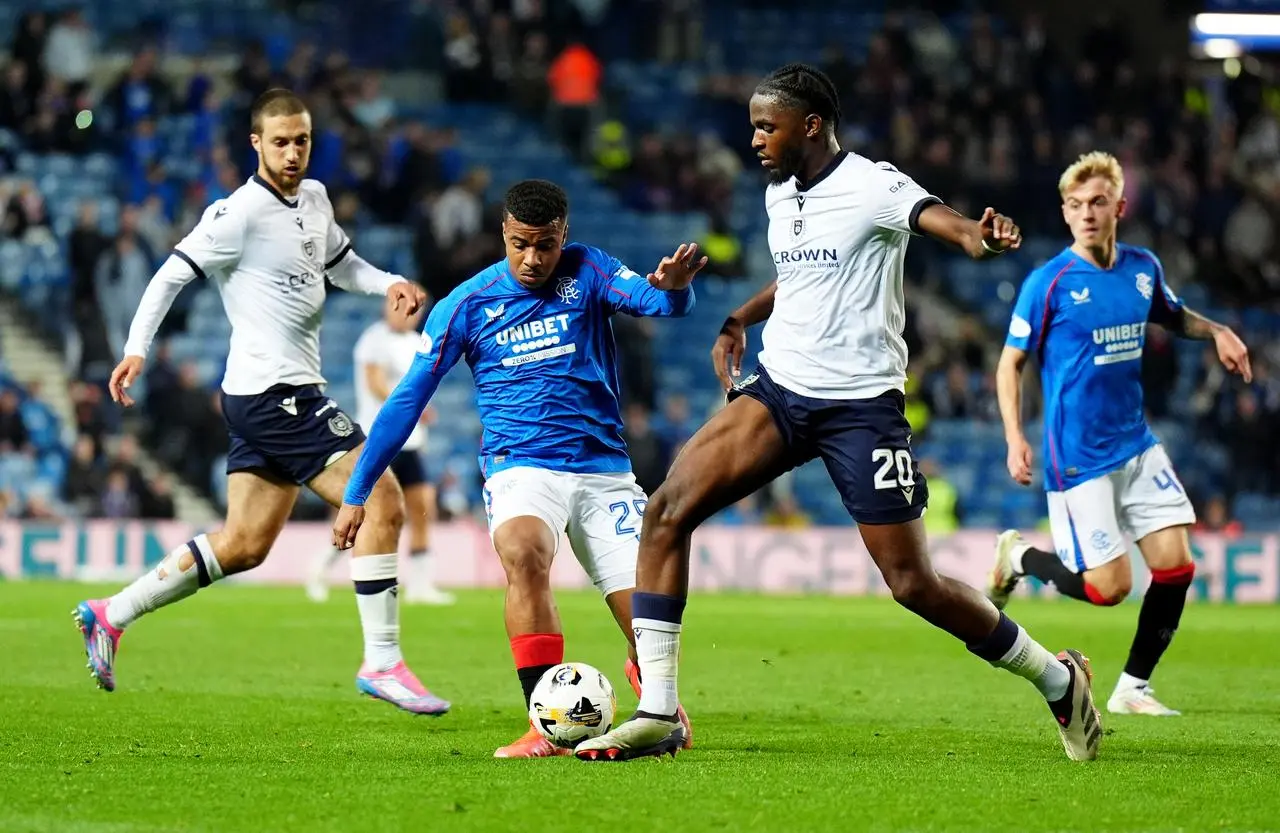 Rangers’ Hamza Igamane, centre left, takes on Dundee’s Billy Koumetio