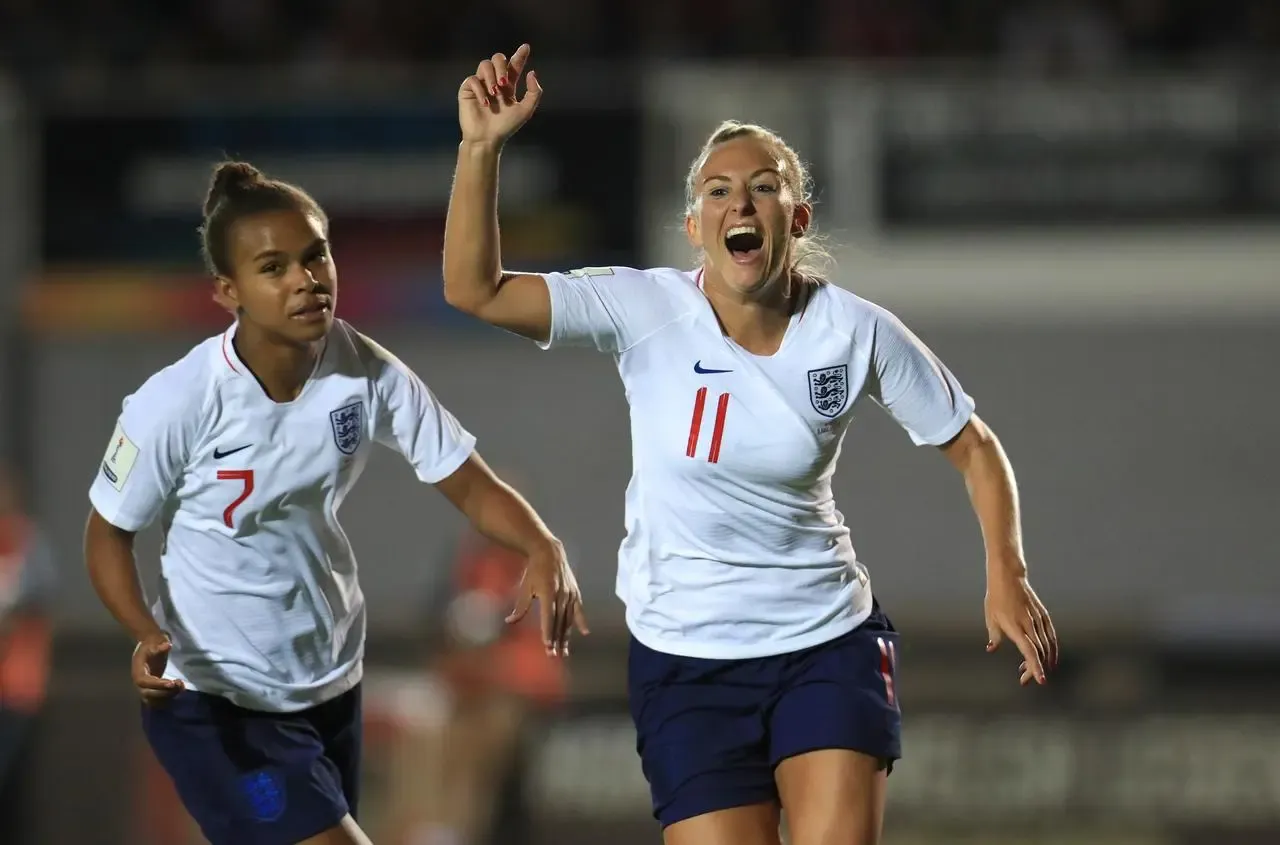 Toni Duggan, right, celebrates scoring for England