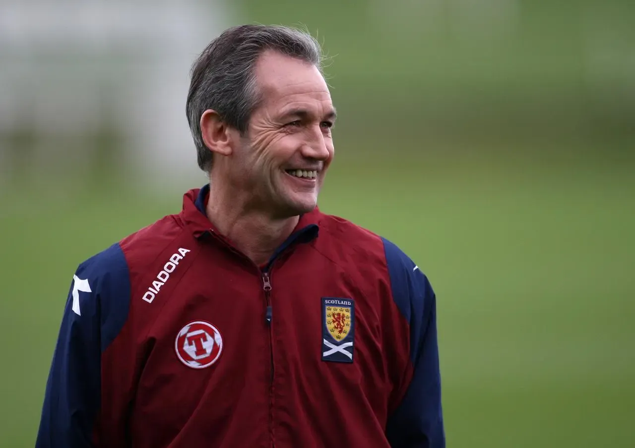 A smiling George Burley looks on during a Scotland training session at Bristol City's training ground