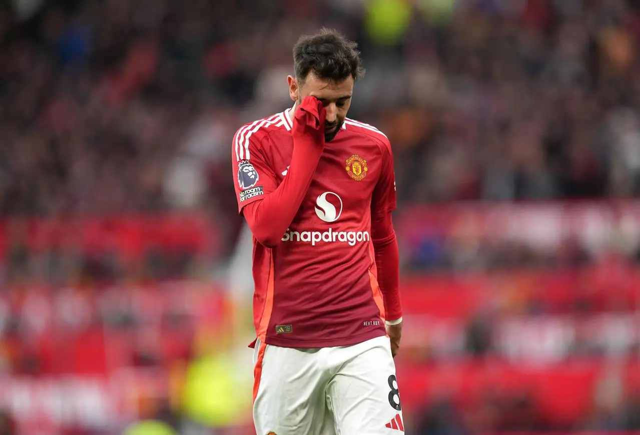 Manchester United’s Bruno Fernandes walks off after being shown a red card against Tottenham at Old Trafford