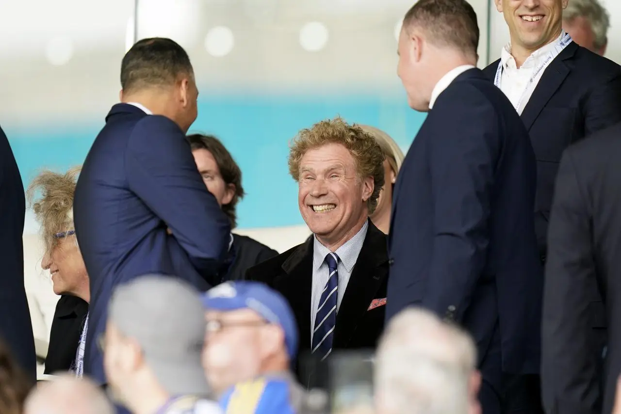 Leeds minority shareholder Will Ferrell (centre) in the stands with chief executive Angus Kinnear (right) at Elland Road