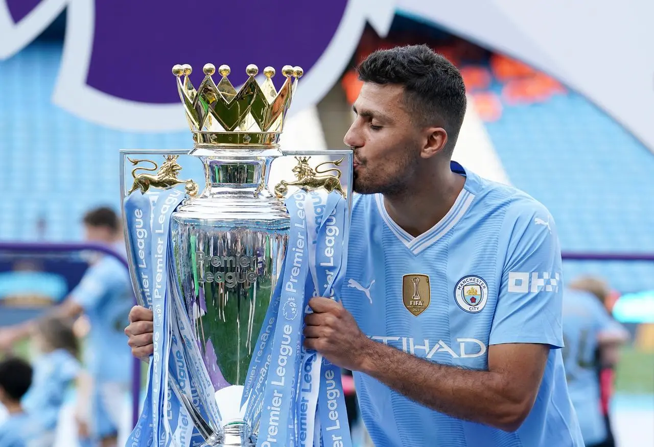 Rodri with the Premier League trophy