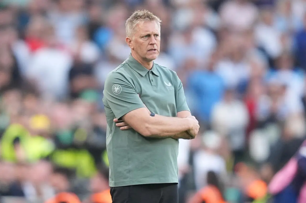 Heimir Hallgrimsson stands with his arms folded