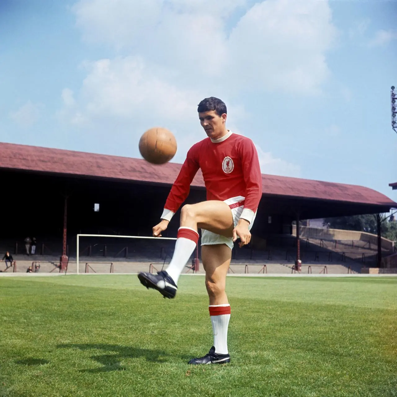 Yeats in the red of Liverpool kicks the ball in a warm up.