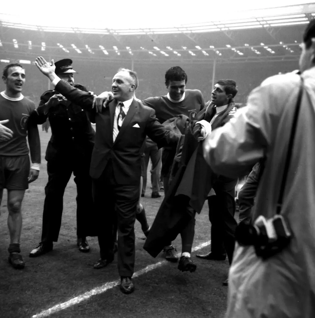 Yeats celebrates Liverpool's first FA Cup win with manager Bill Shankly on the pitch at Wembley. 