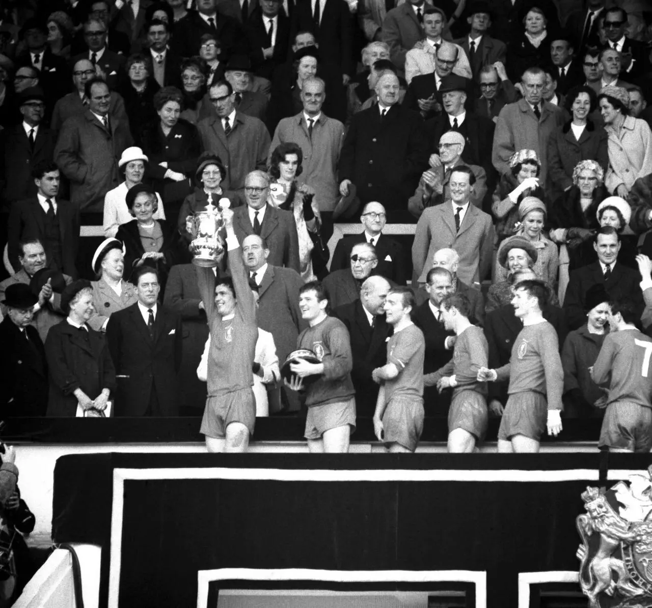 Yeats holds the FA Cup aloft after receiving it from the Queen at Wembley in 1965.