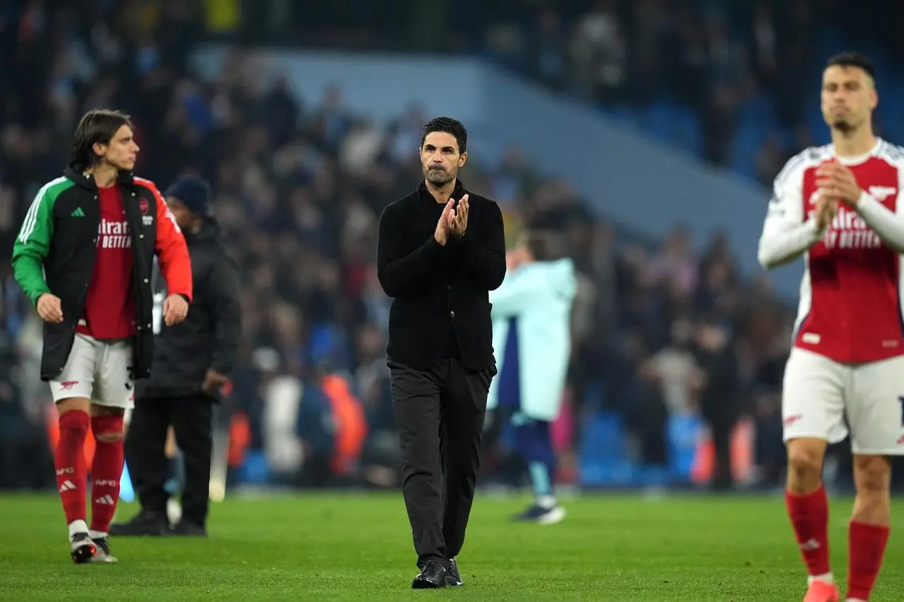 Arsenal manager Mikel Arteta applauds the fans following the Premier League match at the Etihad Stadium