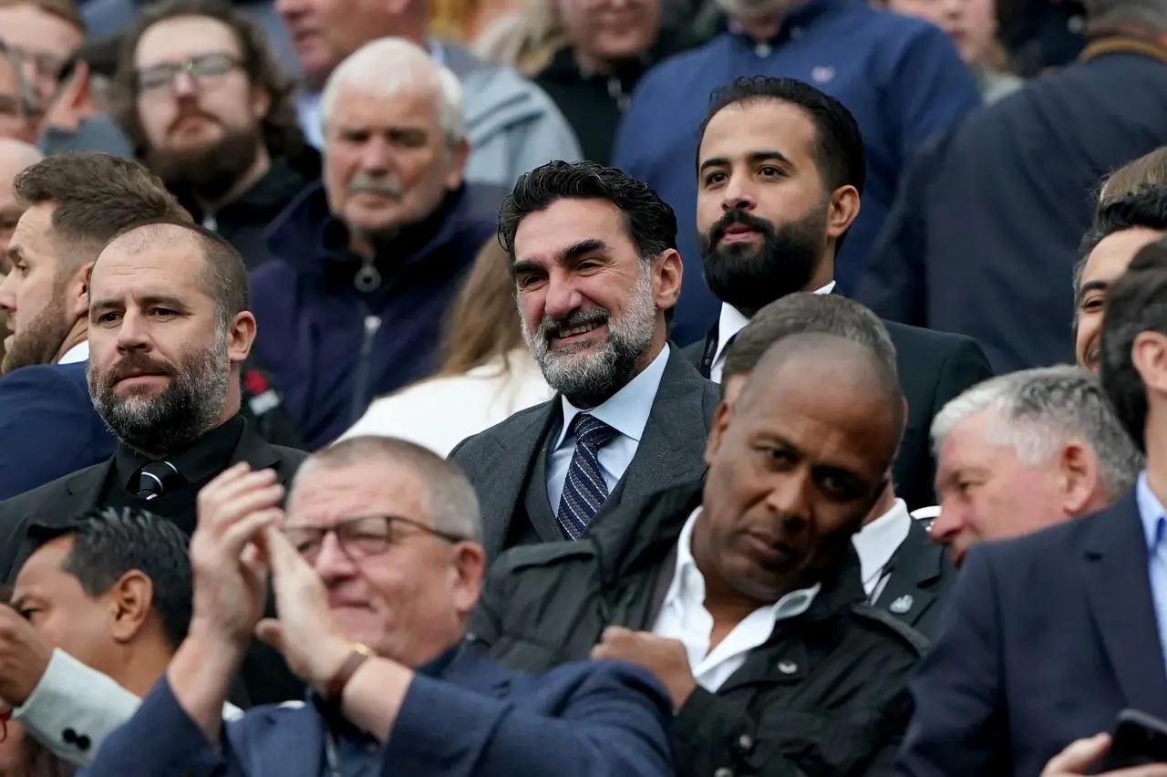 Chairman Yasir Al-Rumayyan, centre, watches Newcastle's win over Tottenham