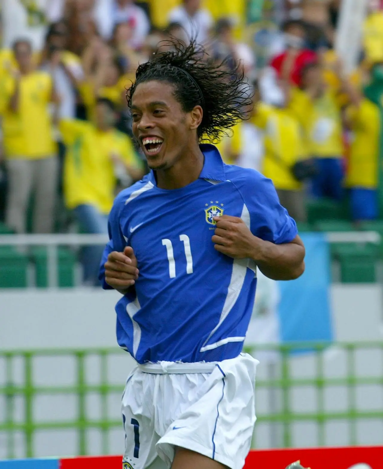 Ronaldinho celebrates after scoring for Brazil against England at the 2002 World Cup