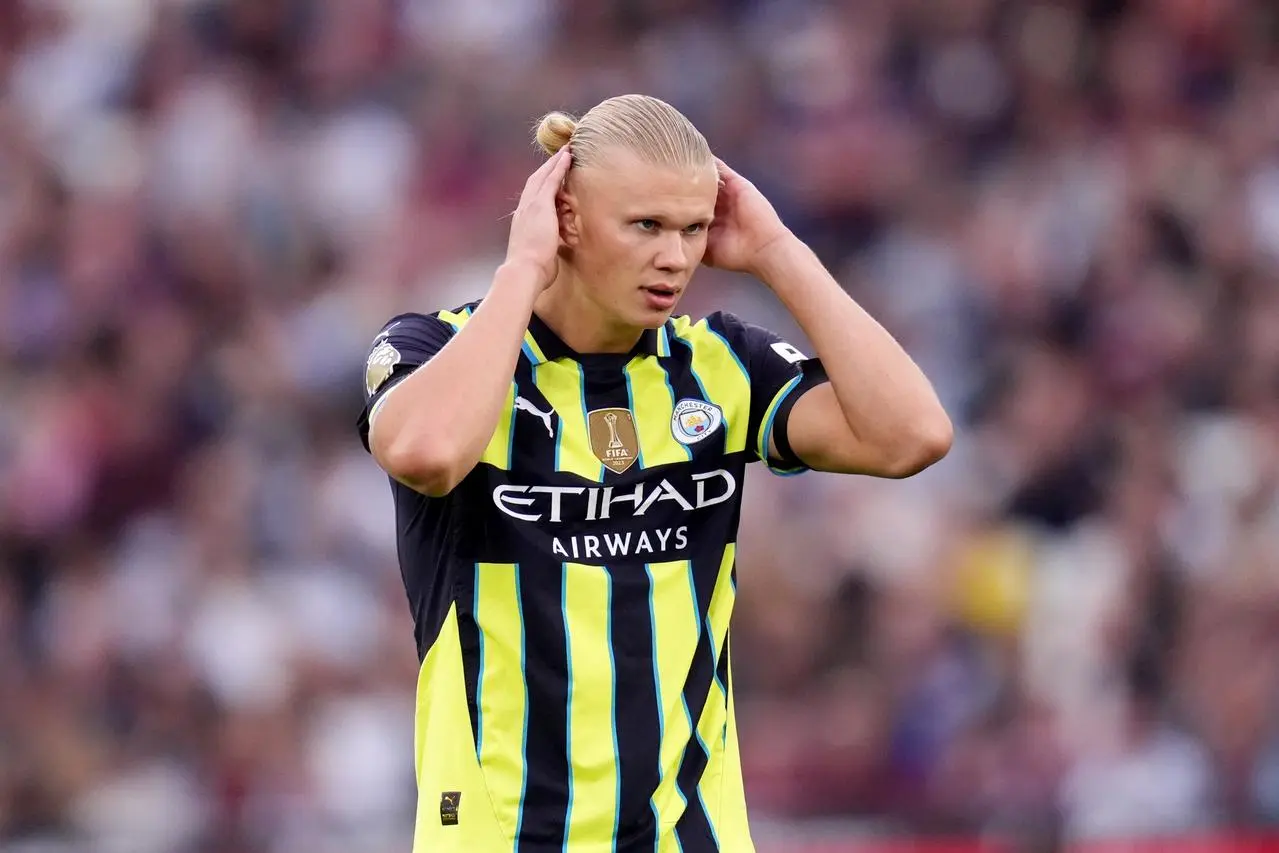 Erling Haaland holds his head during the Premier League match at West Ham 