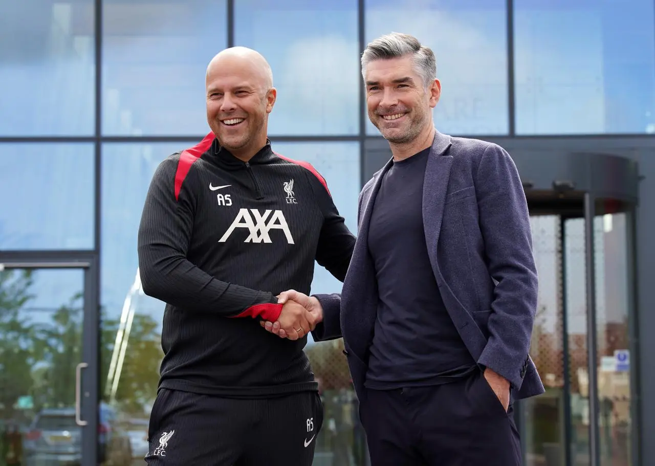 Liverpool head coach Arne Slot shakes hands with sporting director Richard Hughes