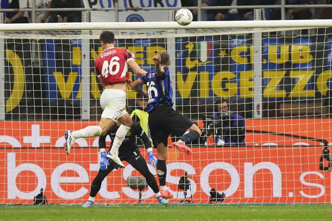 AC Milan’s Matteo Gabbia (left) scores a late winner at Inter Milan