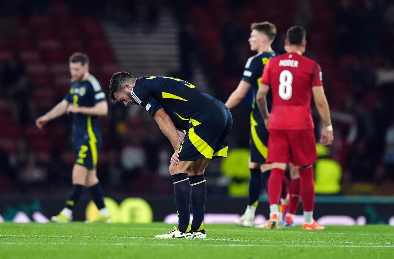 Scotland’s Grant Hanley stoops over in dejection 