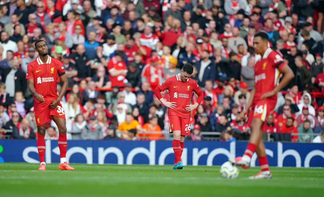 Liverpool’s Andy Robertson and Ryan Gravenberch look dejected 