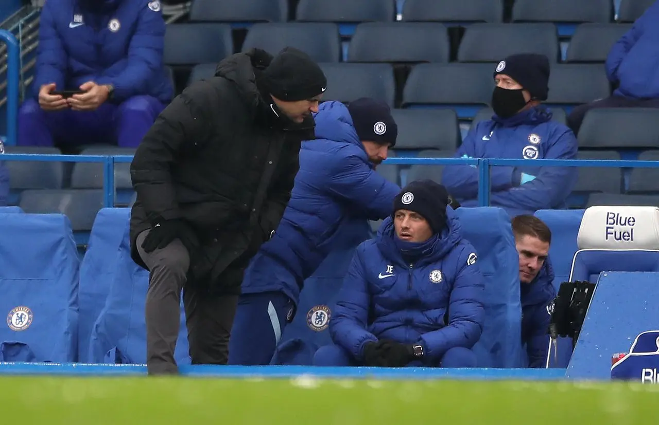 Coaches Frank Lampard, Jody Morris and Anthony Barry in the dugout at a game at Stamford Bridge