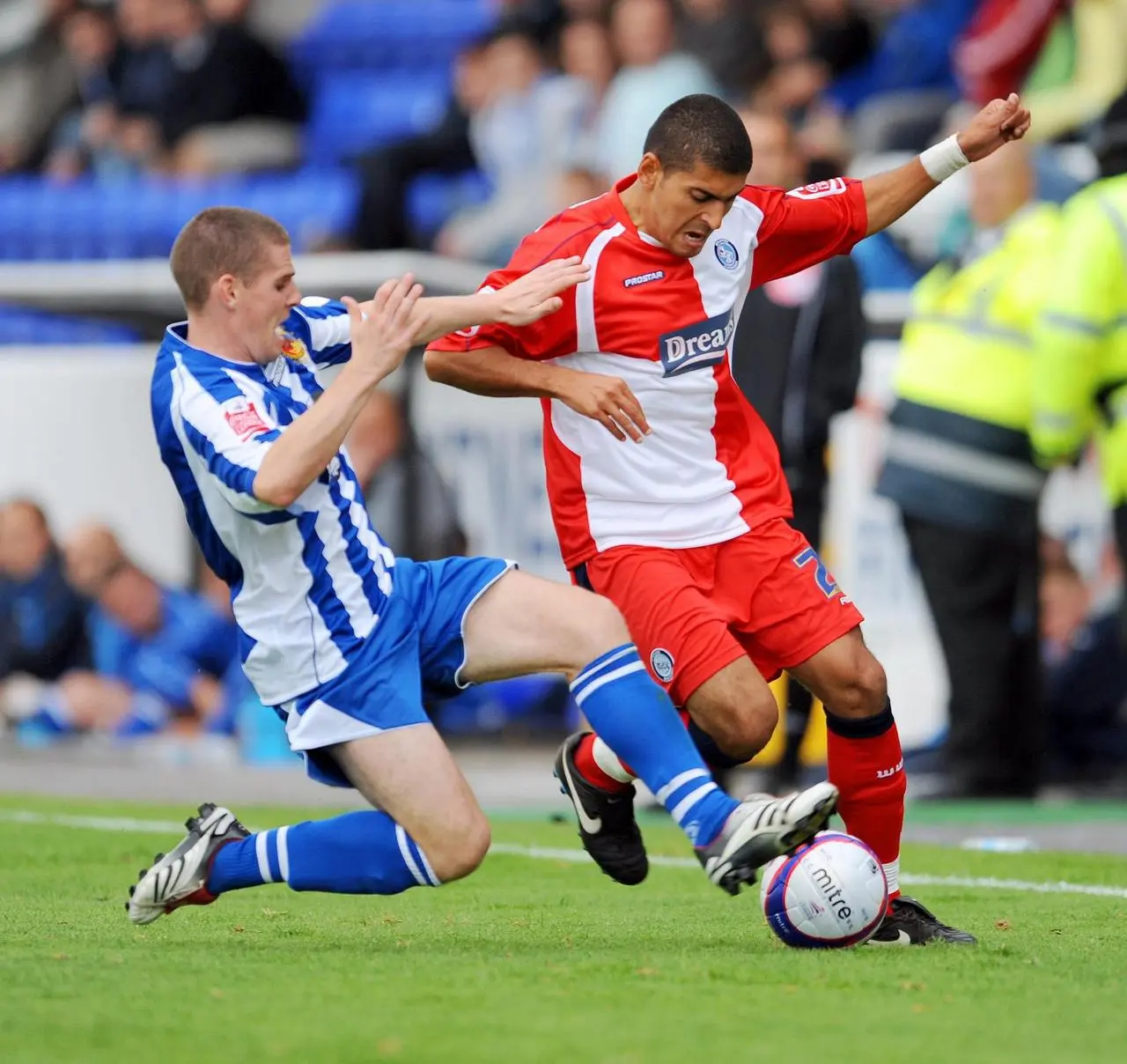 New England assistant manager Anthony Barry (left) tussles for the ball with Wycombe’s Magno Vieira while playing for Chester