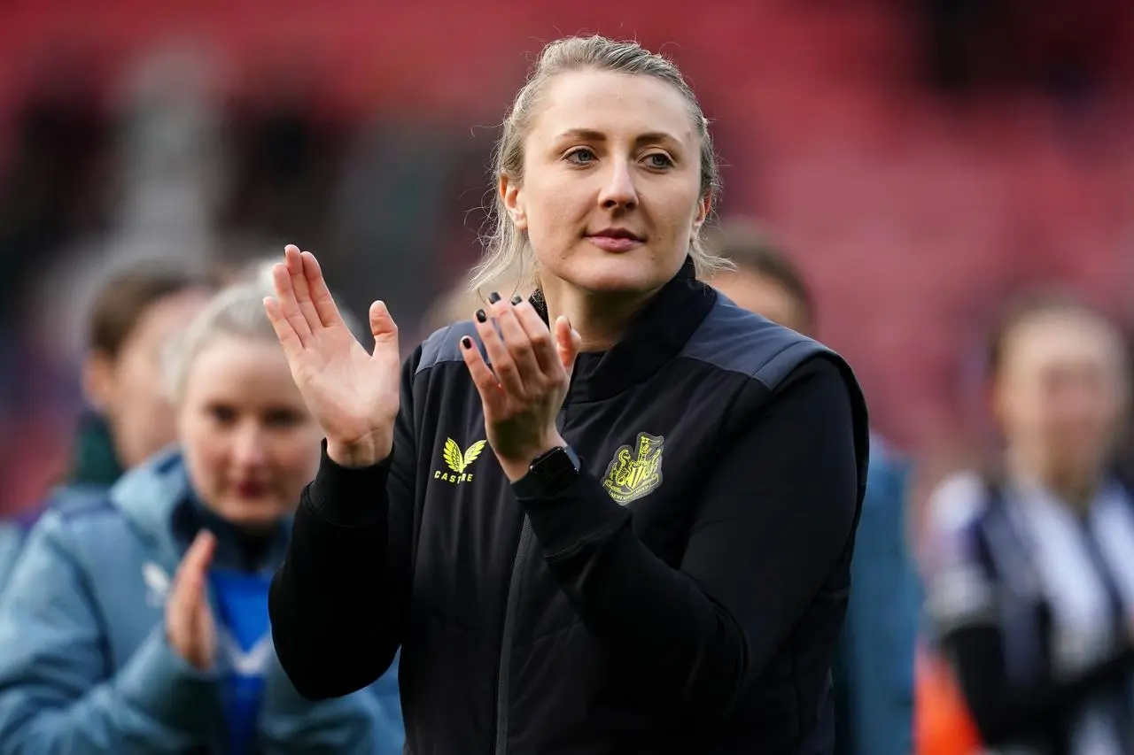 Becky Langley applauding fans