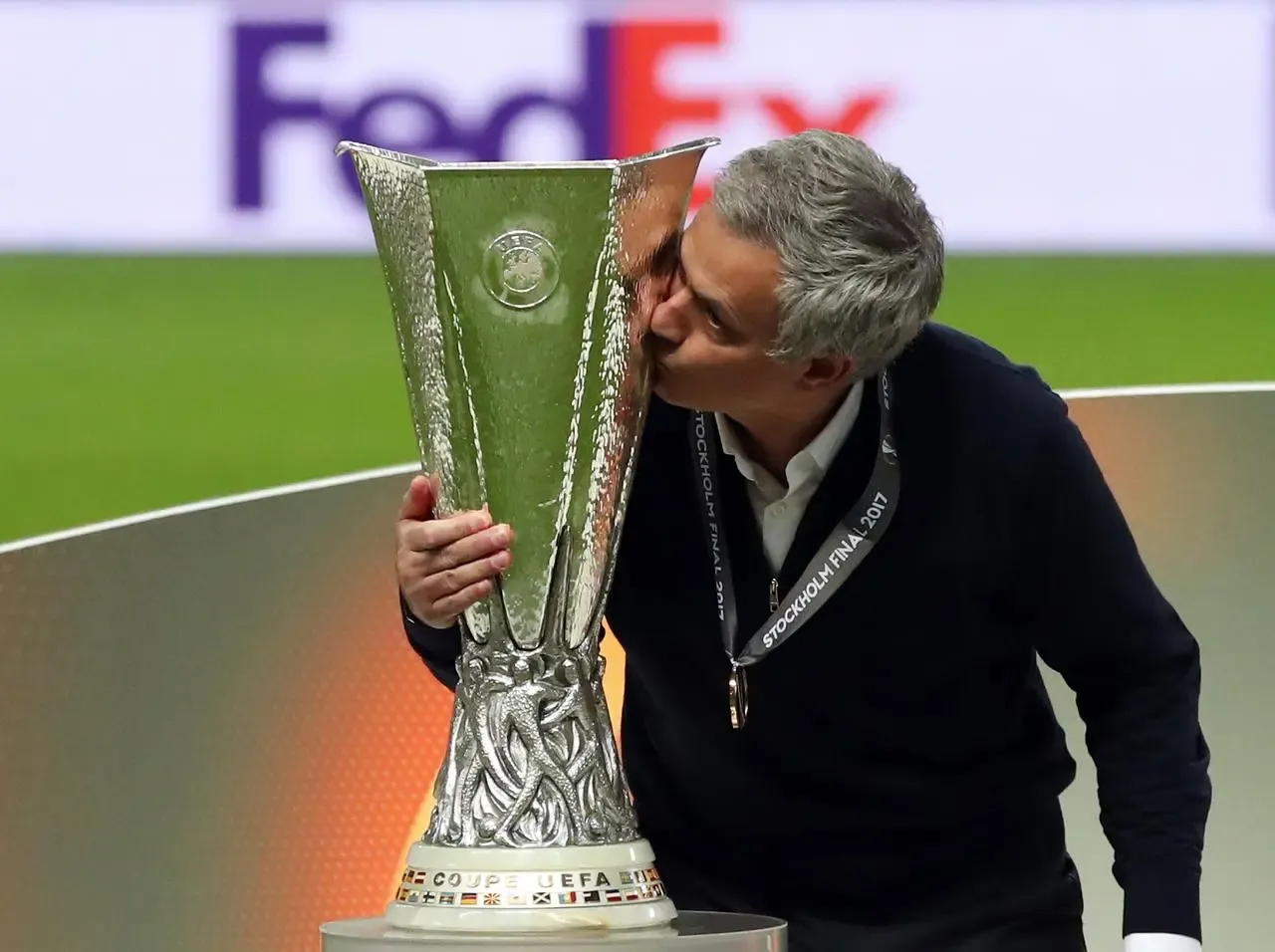 Jose Mourinho kisses the Europa League trophy