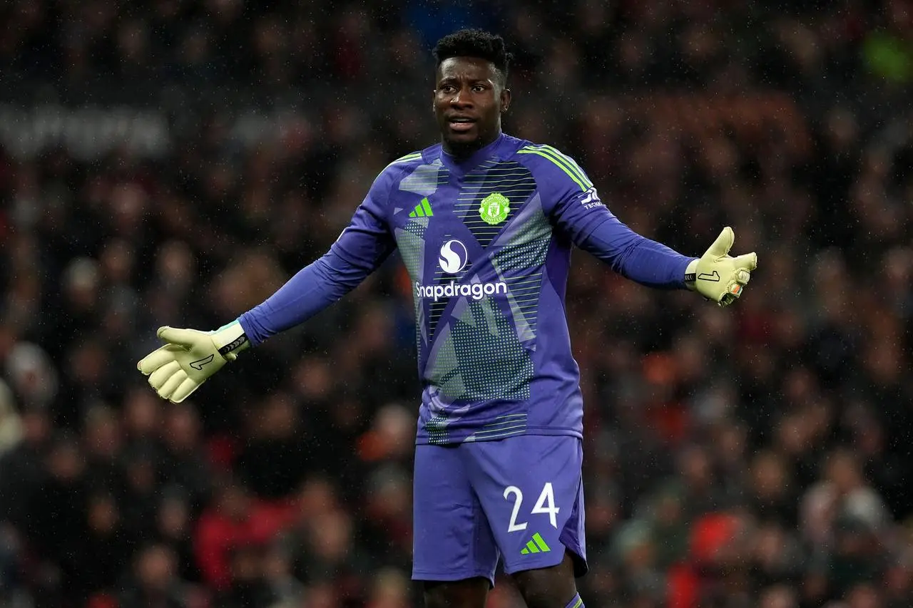 Manchester United goalkeeper Andre Onana reacts after conceding to FC Twente