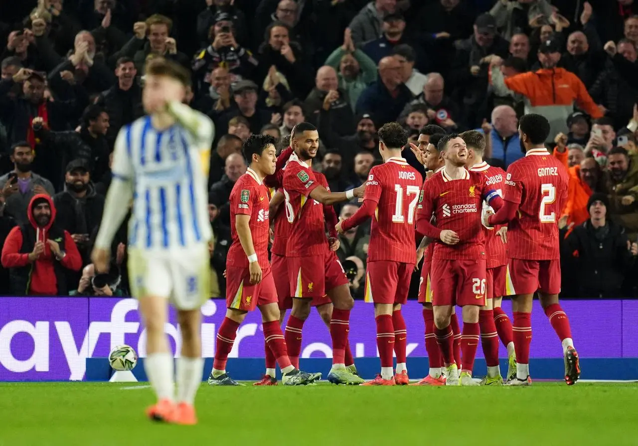 Cody Gakpo, centre left, celebrates scoring Liverpool's first against Brighton