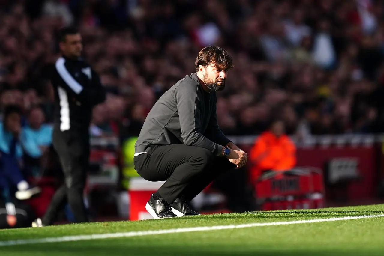 Zac Goodwin crouches on the touchline at the Emirates