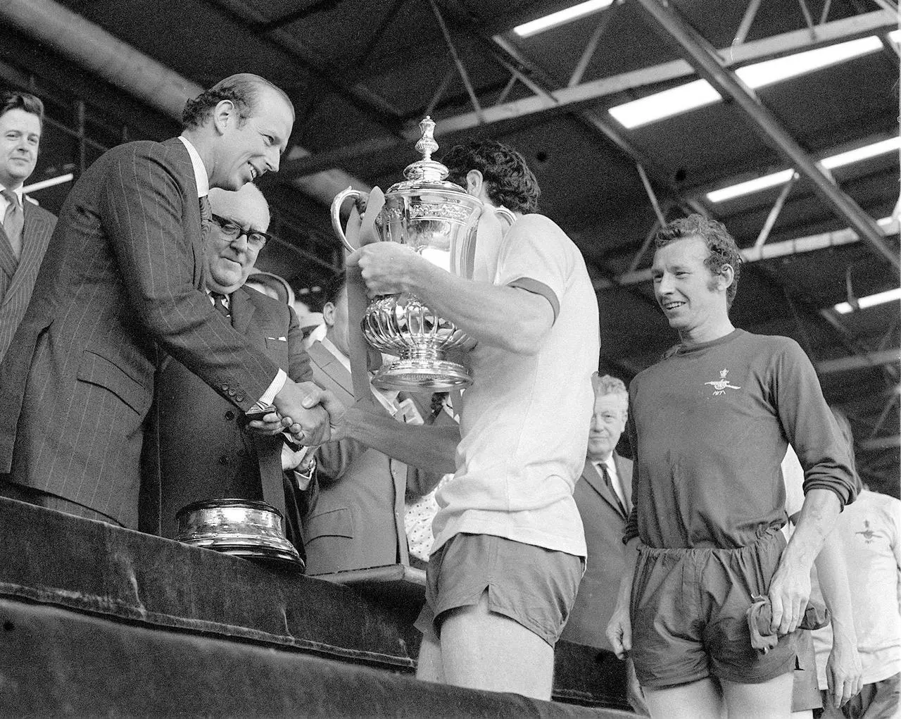 Bob Wilson second in line as Arsenal are presented the FA Cup in 1971