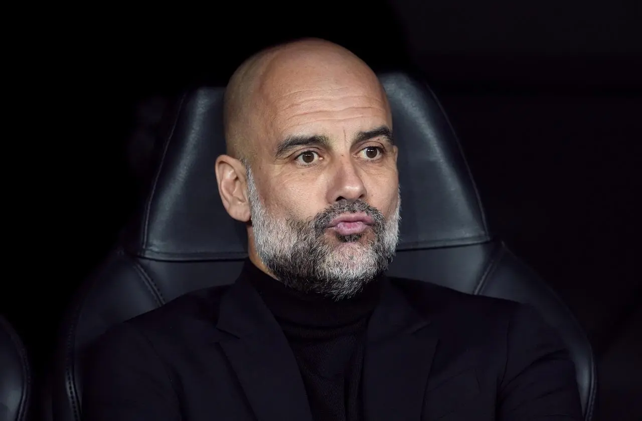 Pep Guardiola pictured in the dugout