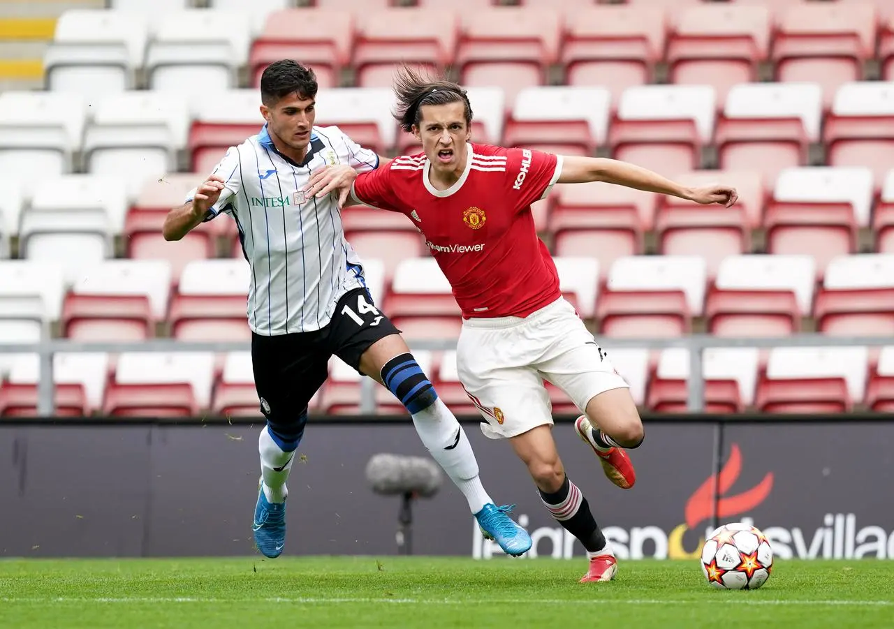 Manchester United's Alvaro Carreras and Atalanta’s Andrea Oliveri battle for the ball during a UEFA Youth League match