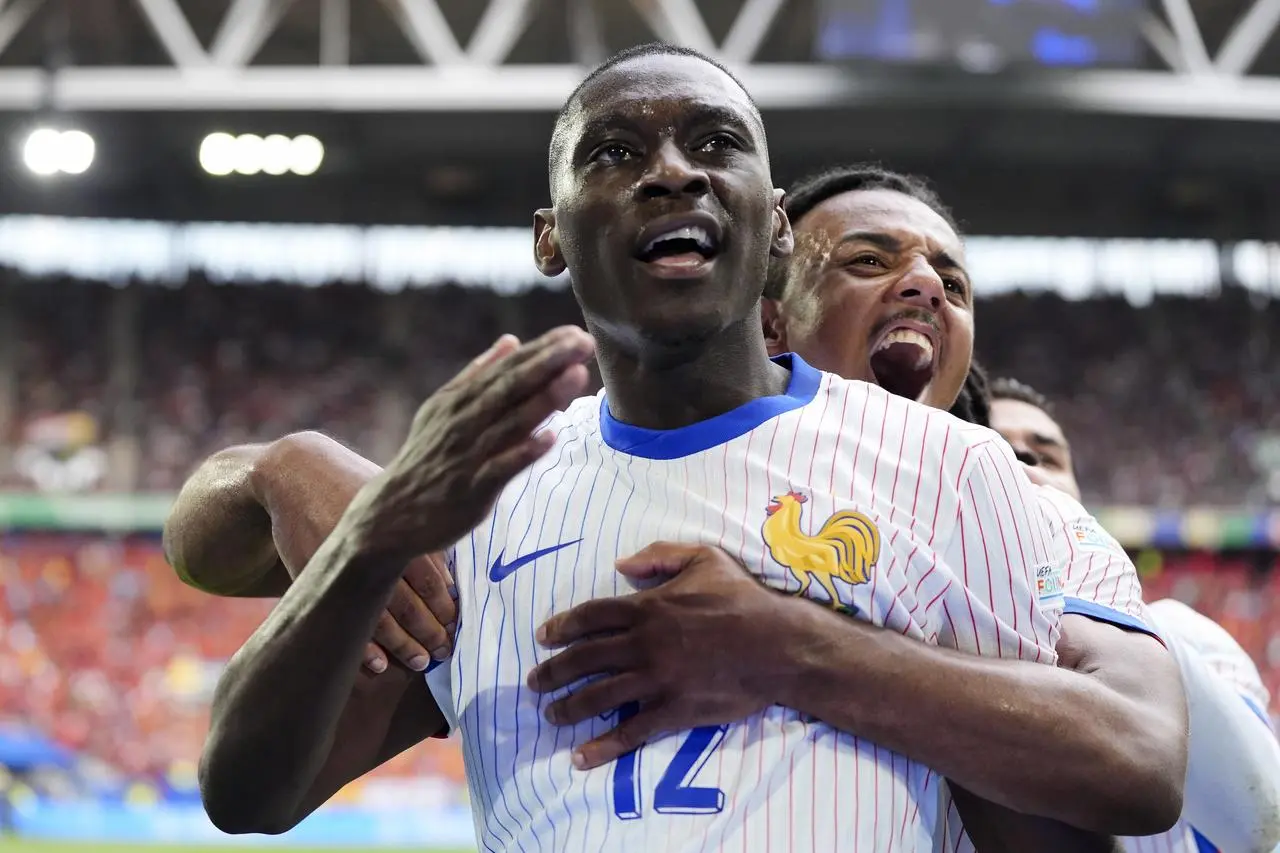 France’s Randal Kolo Muani (left) celebrates a goal