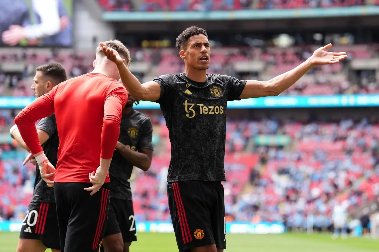 Raphael Varane gestures towards the crowd 