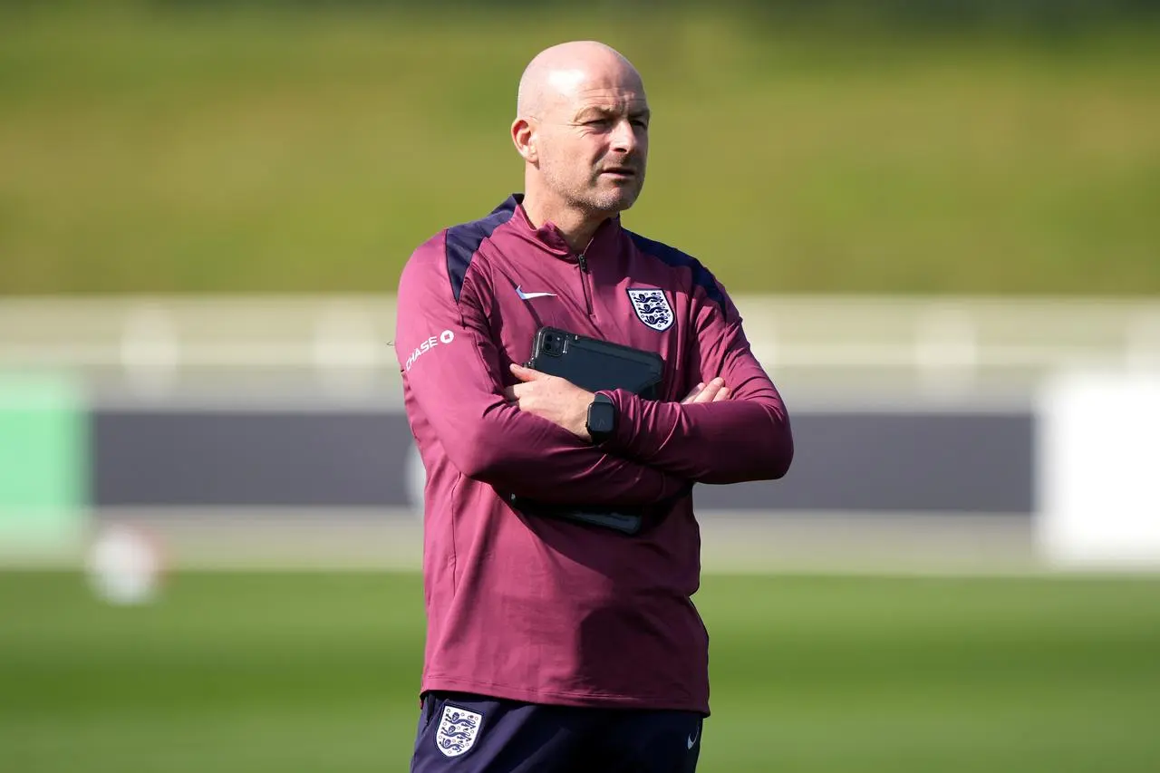 England interim head coach Lee Carsley crosses his arms during a training session