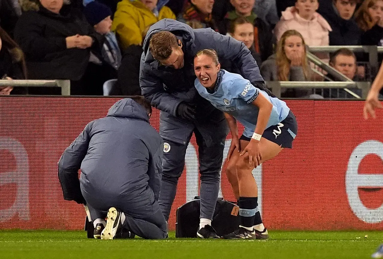 Naomi Layzell receives treatment for an injury sustained during Manchester City's Champions League win over Barcelona