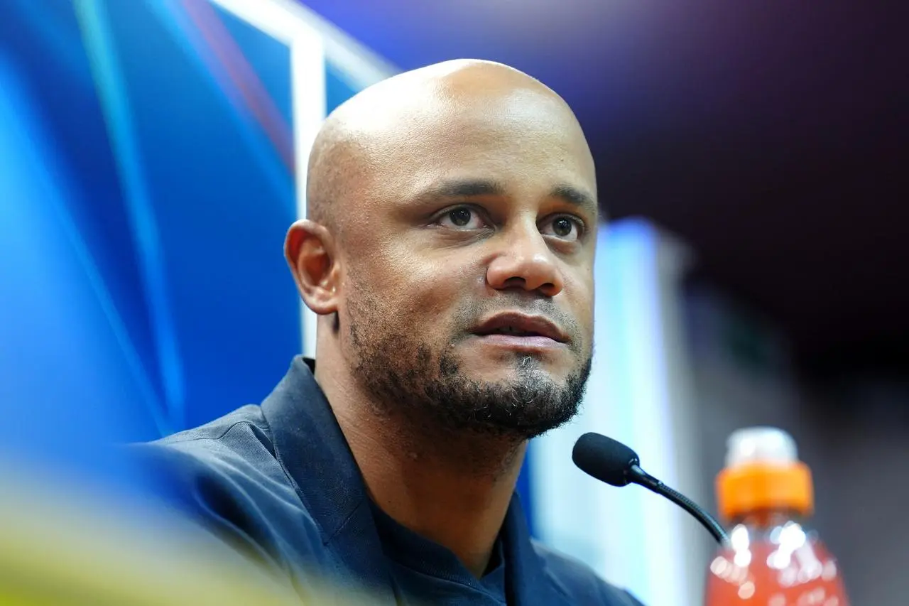 Vincent Kompany talks during a press conference