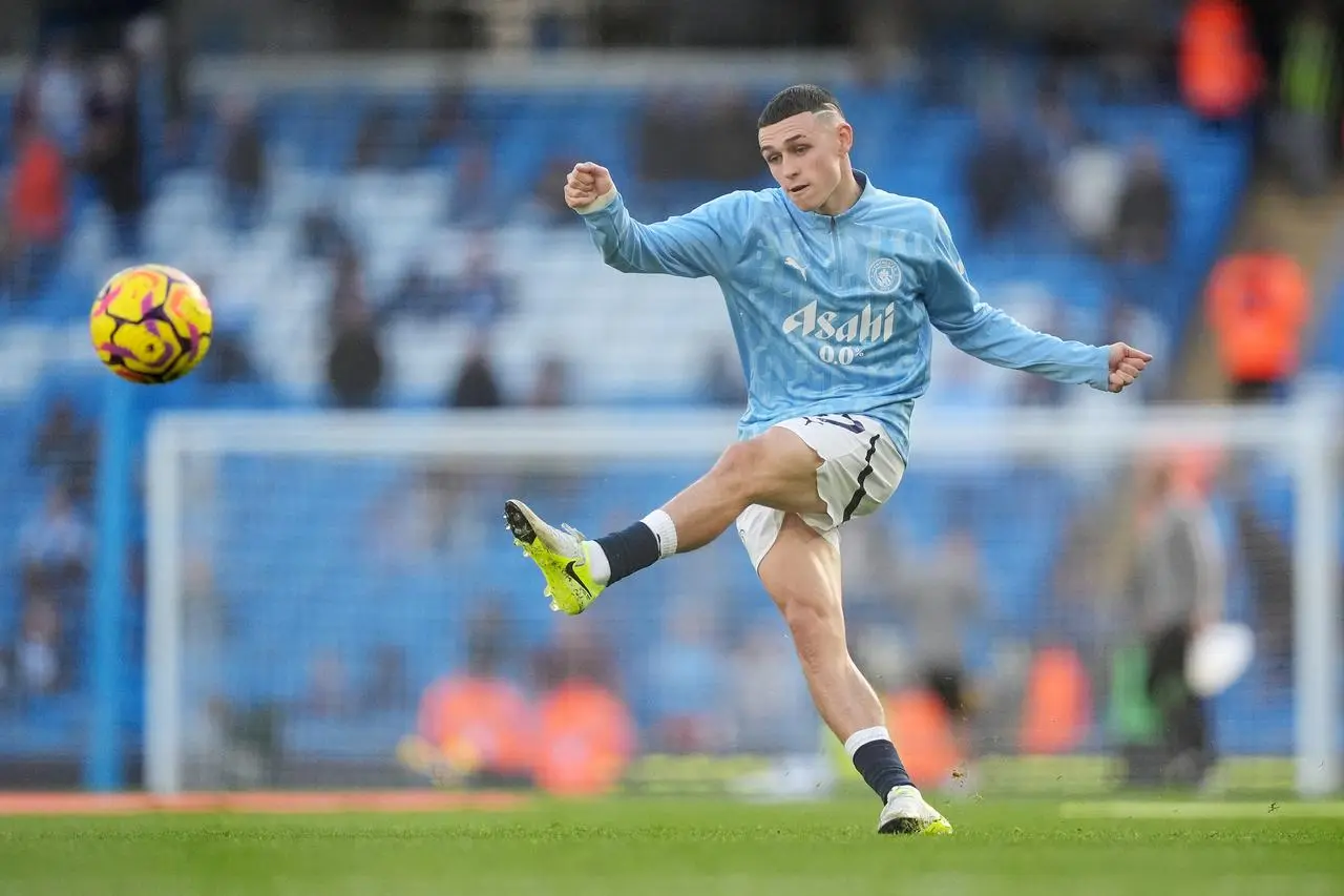 Phil Foden kicks the ball with his left foot during a warm-up