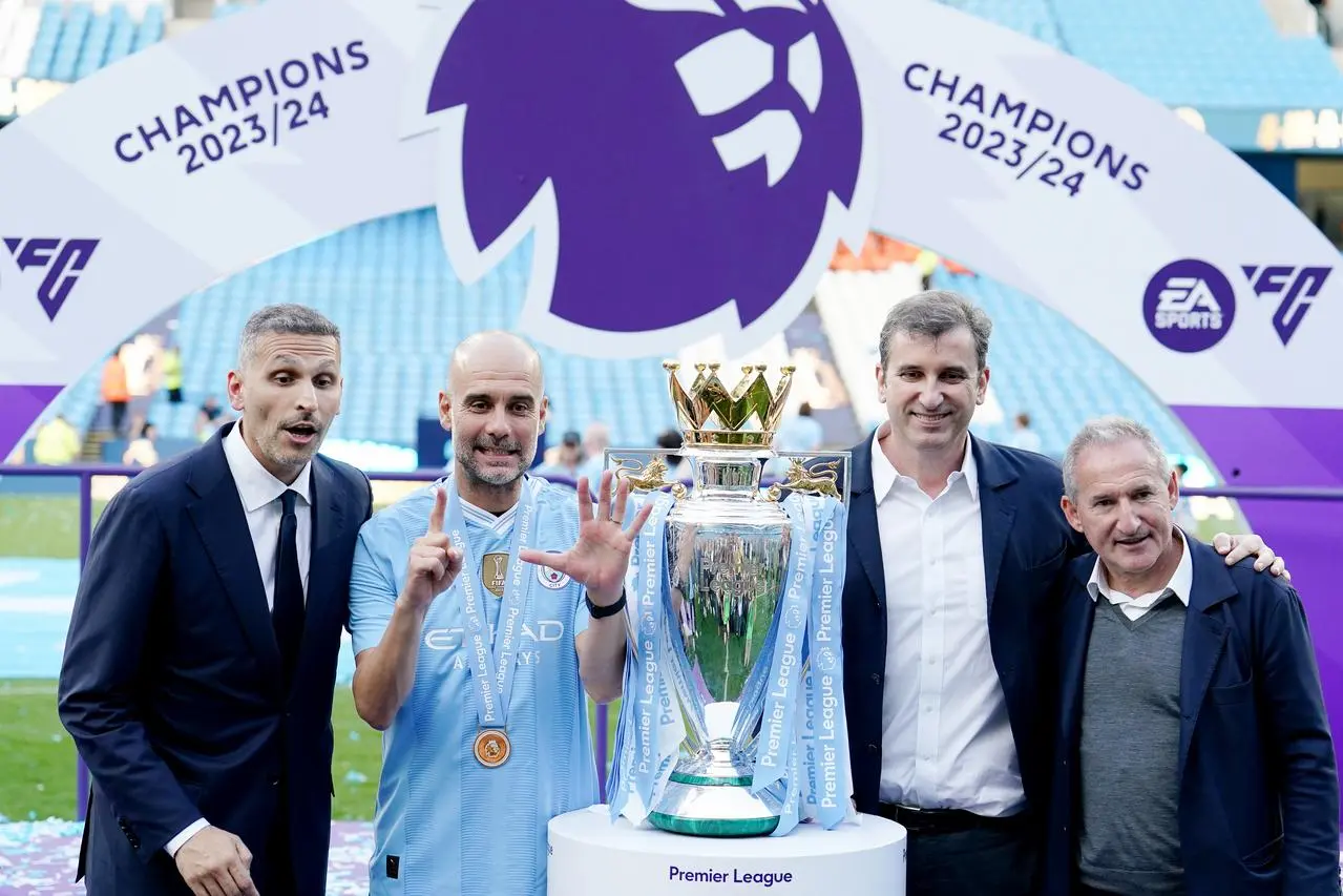 Manchester City chairman Khaldoon Al Mubarak, manager Pep Guardiola, CEO Ferran Soriano and director of football Txiki Begiristain celebrate winning the Premier League title