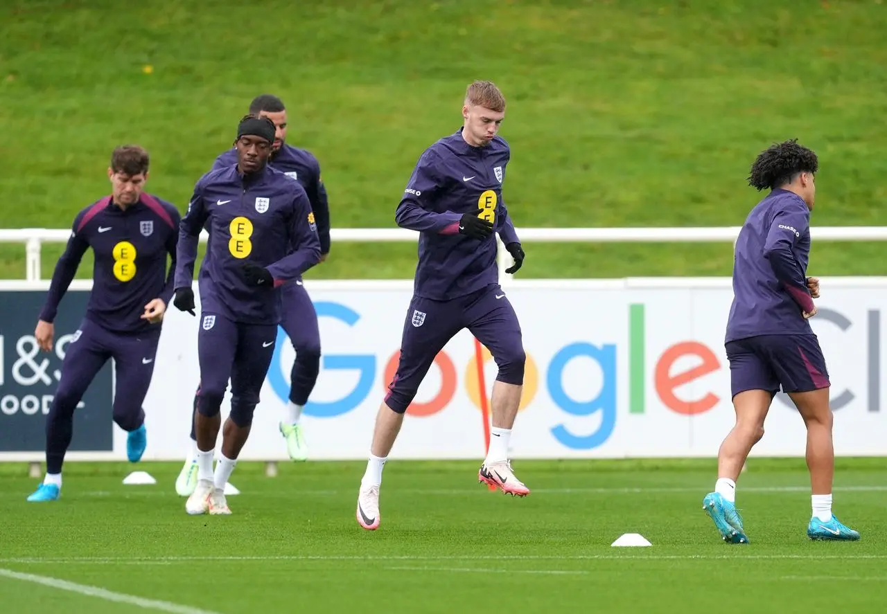 England’s John Stones, Noni Madueke, Cole Palmer and Rico Lewis run during a training session 