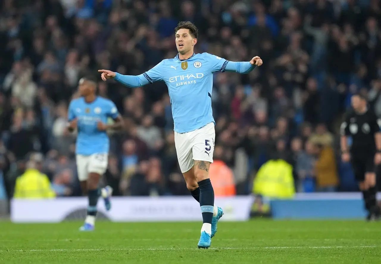 John Stones celebrates scoring Manchester City's equaliser against Arsenal 