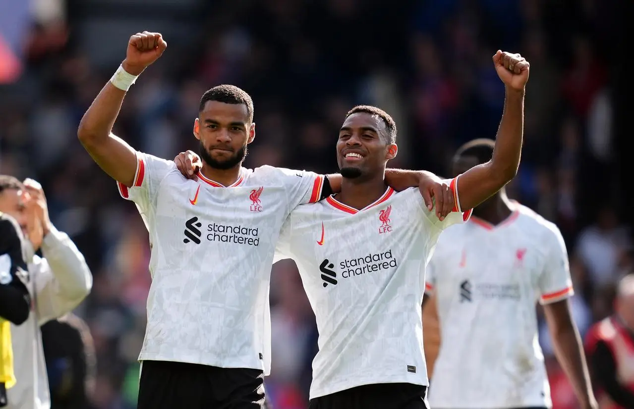 Cody Gakpo and Ryan Gravenberch (right) celebrate at the final whistle