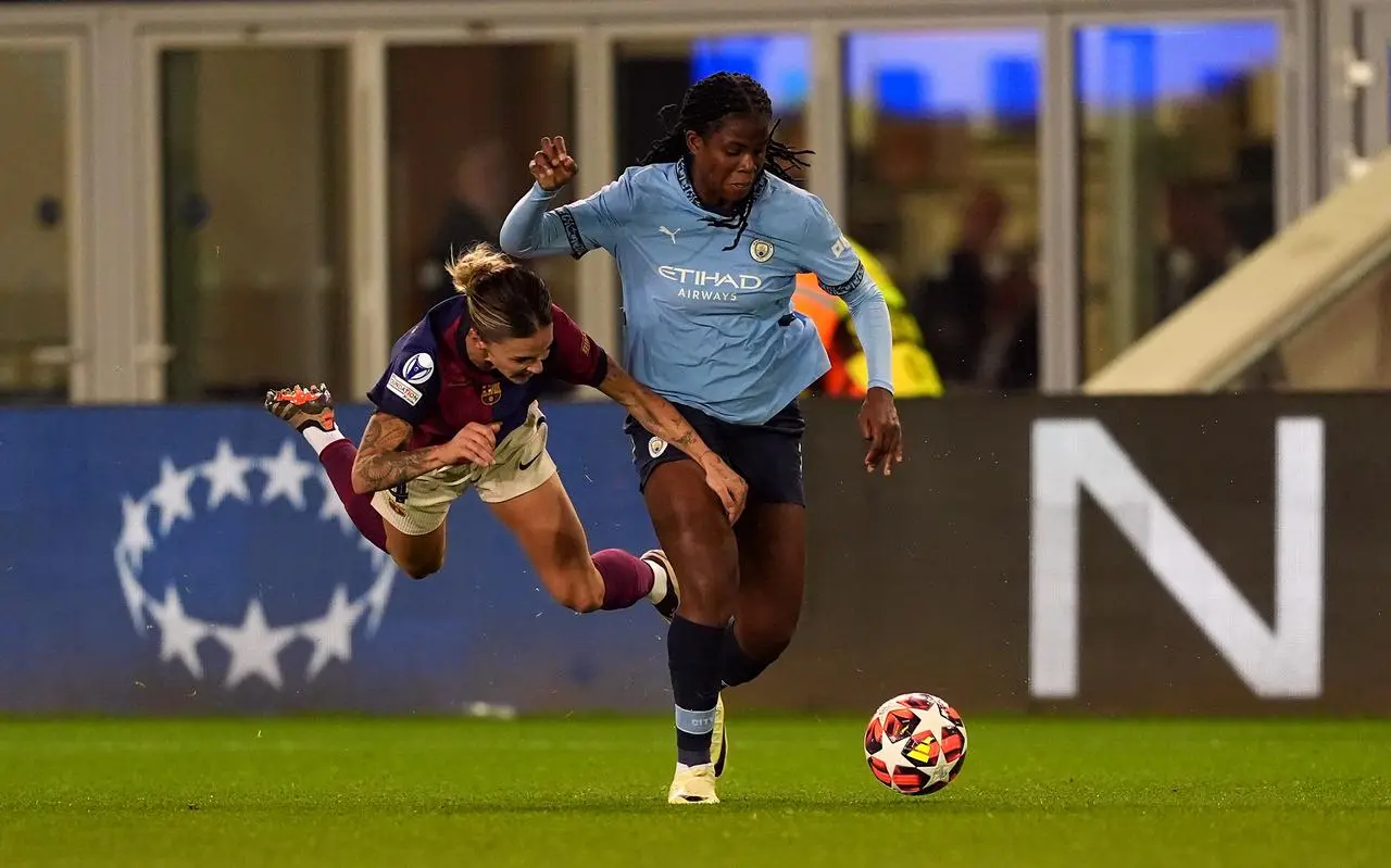 Manchester City’s Khadija Shaw and Barcelona’s Mapi Leon (left) battle for the ball