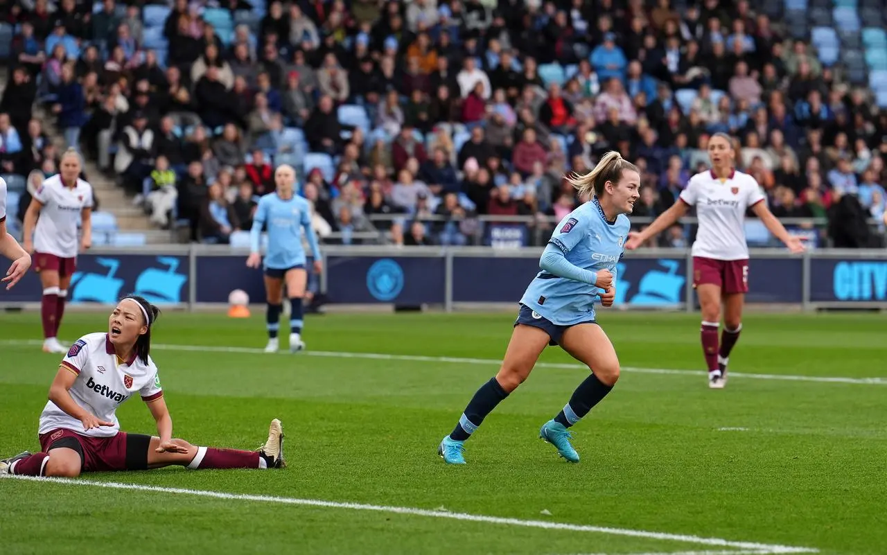 Lauren Hemp celebrating her goal