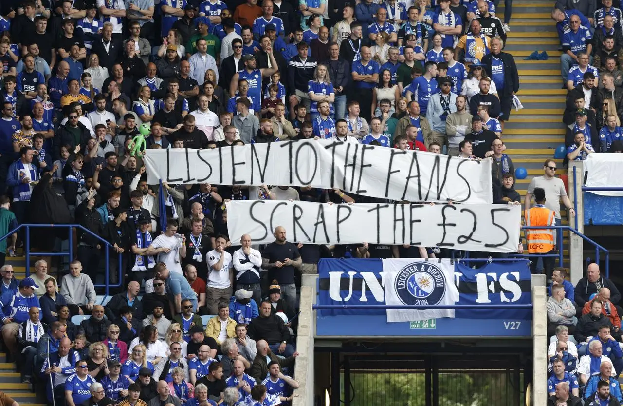 Leicester fans hold up a banner in protest of ticket prices