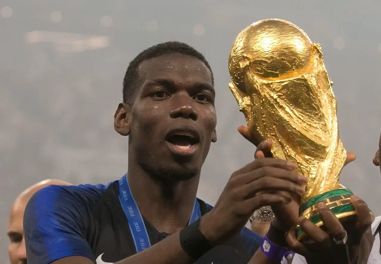 France’s Paul Pogba celebrates with the World Cup trophy