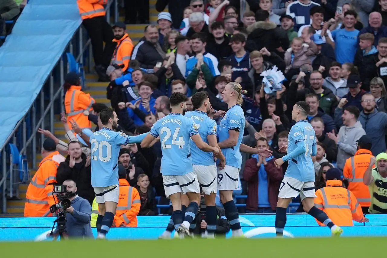 Erling Haaland, centre right, celebrates scoring his goal 