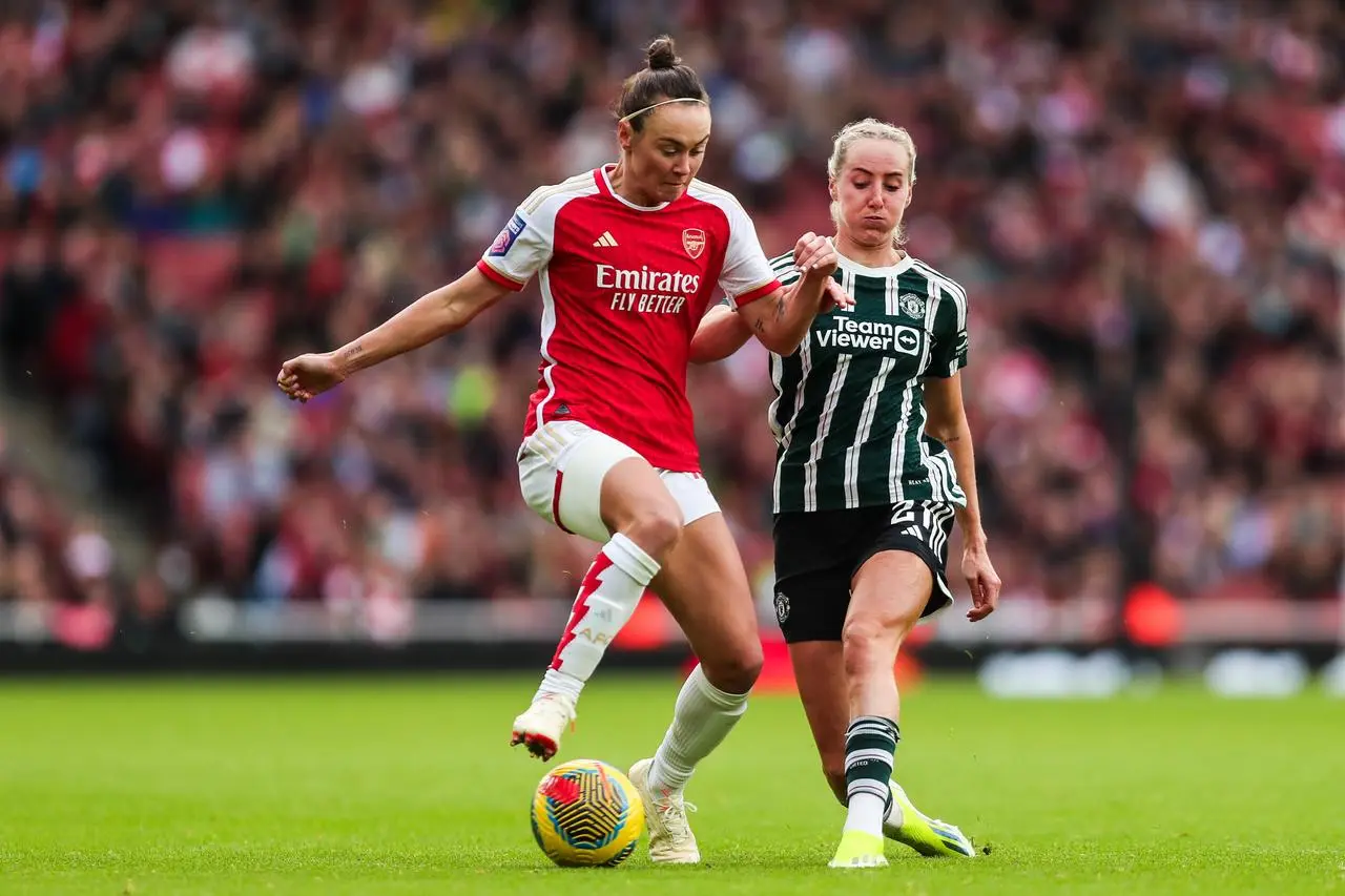 Arsenal’s Caitlin Foord battles for the ball against United’s Millie Turner last season (Rhianna Chadwick/PA)