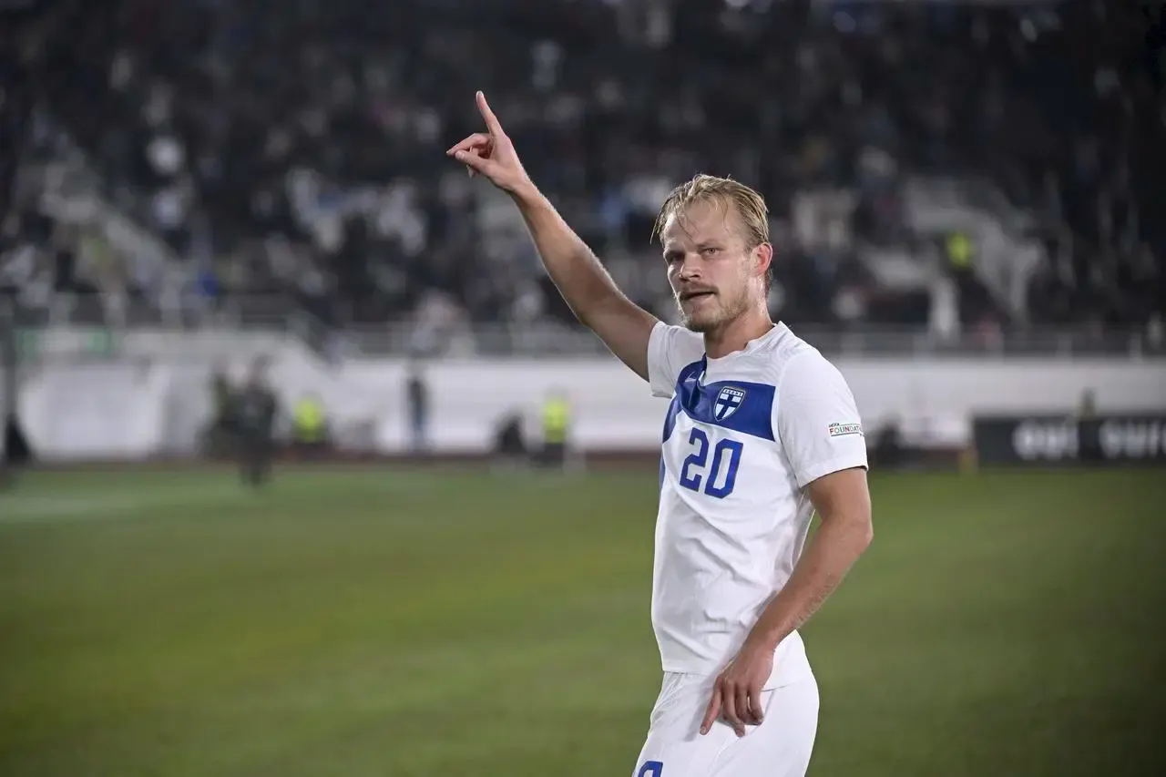 Joel Pohjanpalo of Finland celebrates scoring against Ireland with his finger pointed in the air