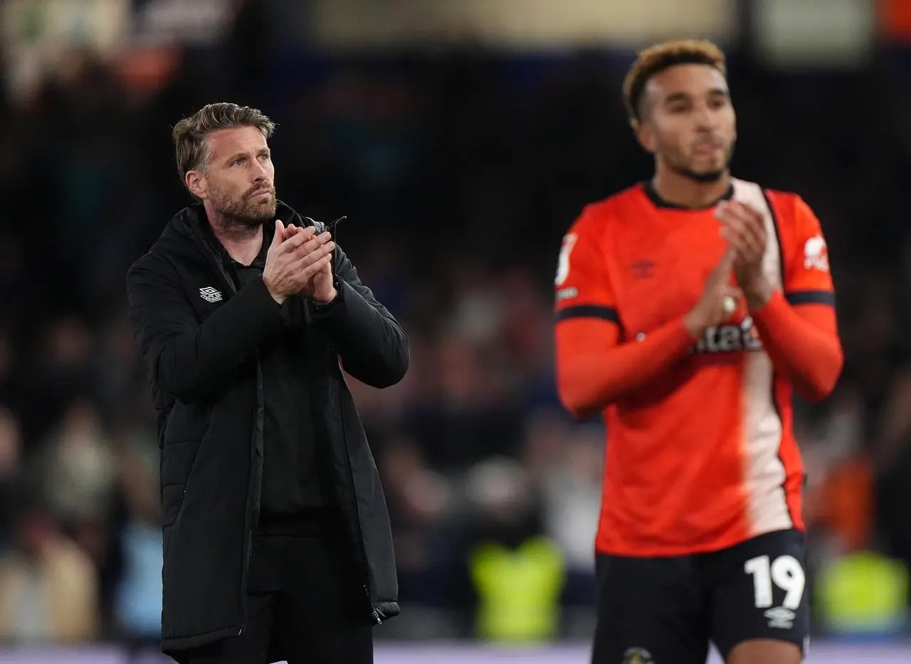 Luton manager Rob Edwards applauds the fans 